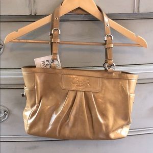 Coach purse camel colored pattern leather